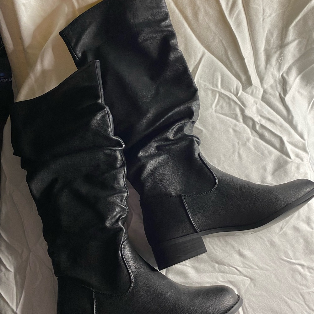 Tall black faux leather slouch boots. New. Size 6